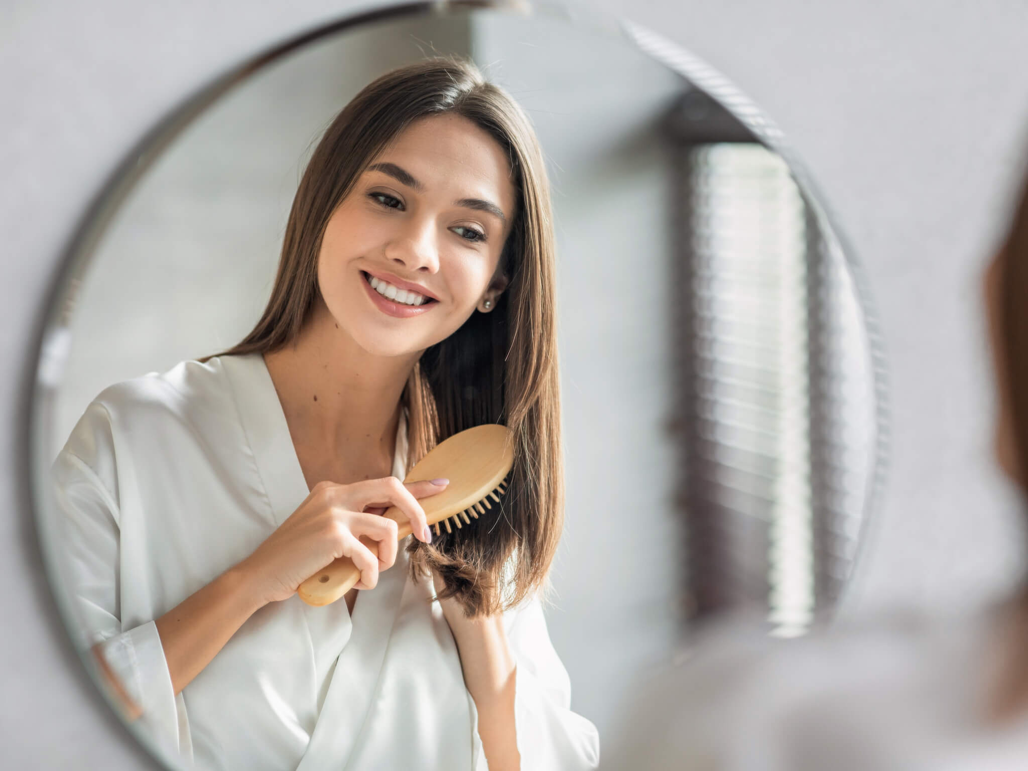 Pretty Woman Combing Her Beautiful Hair With Brush