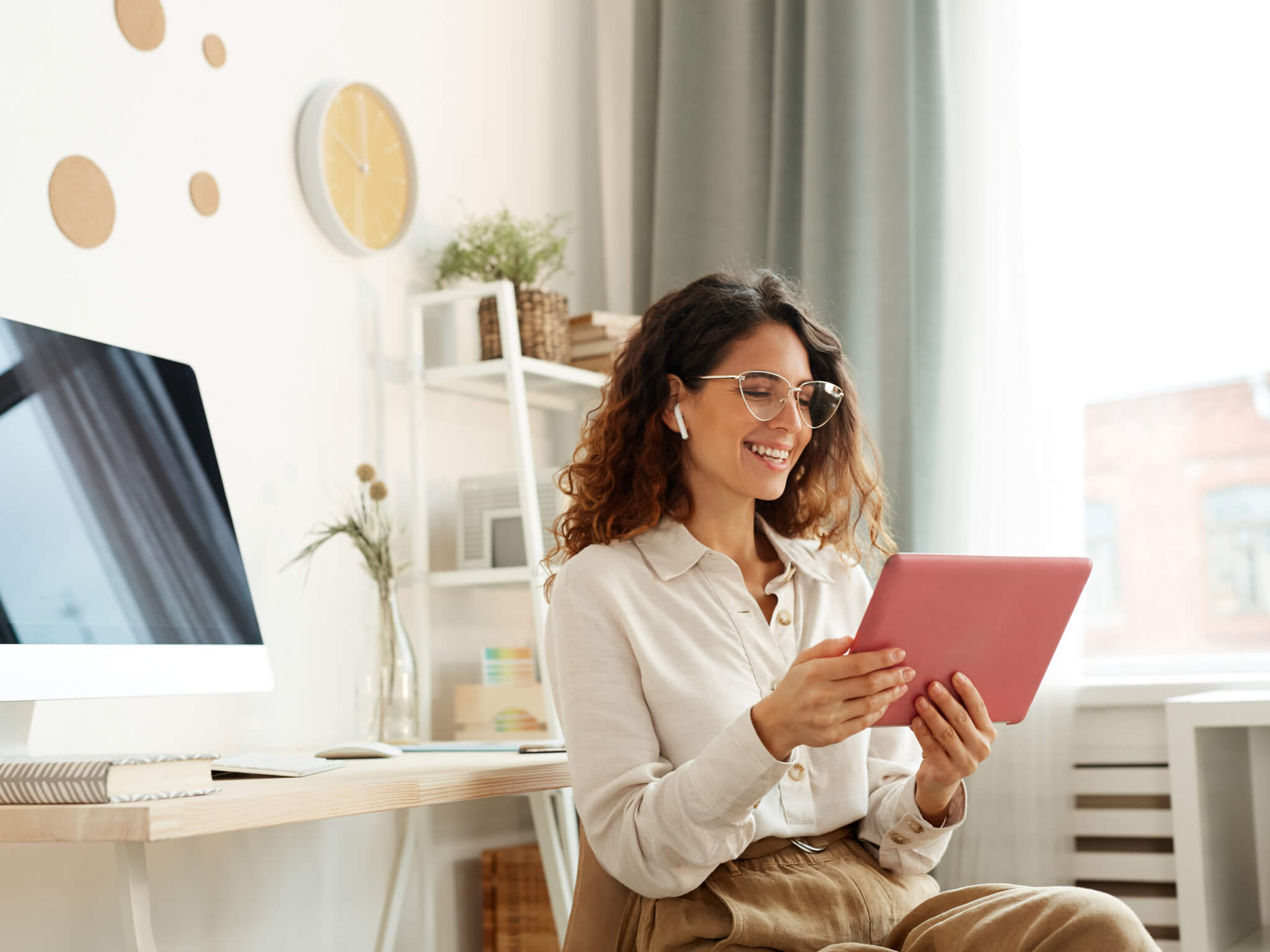 Attractive young woman taking part in online conference