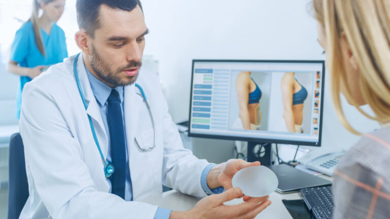 Doctor explaining to patient about breast surgery.
