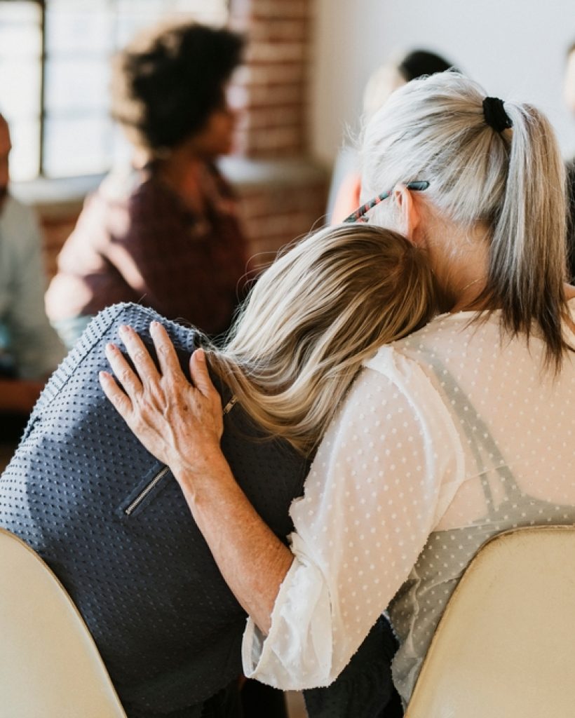 People support each other in a rehab session