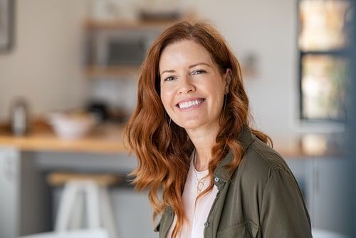 Redhead woman smiling