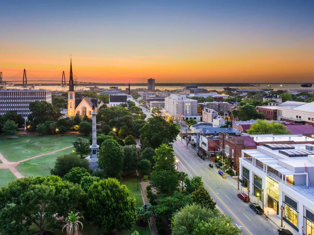 Charleston, South Carolina, USA skyline over Marion Square at dusk.