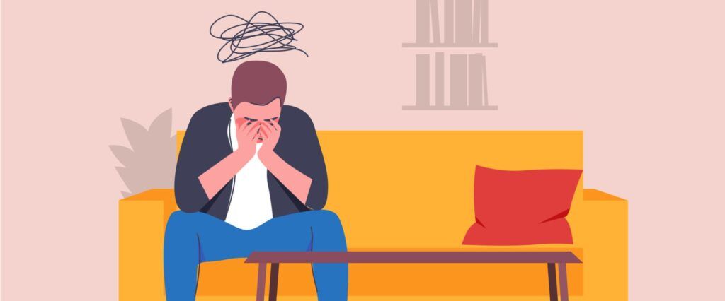 A lonely man sitting on a couch in the office - Flat vector illustration.