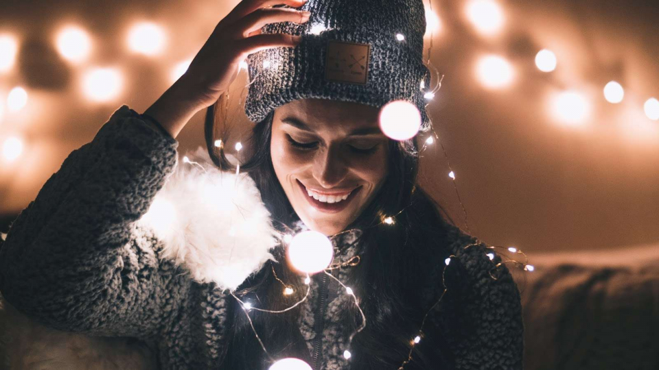 Pretty girl on the street with christmas lights