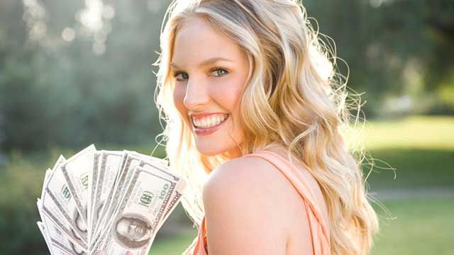young woman with dollar bills