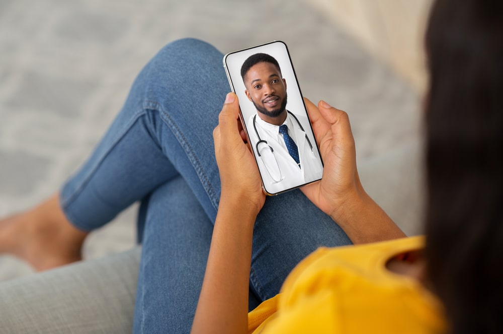 Lady Using Smartphone, Making Video Conference With Her Doctor