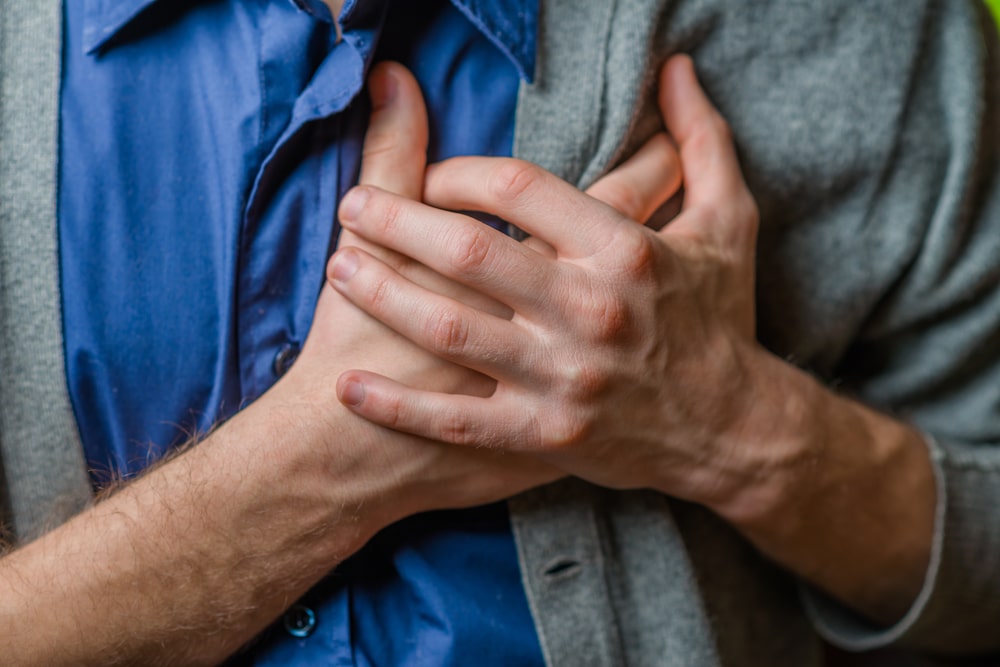 A young man suffering from heart pain