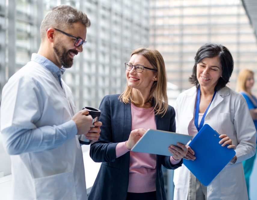 doctors talking to pharmaceutical sales representative.