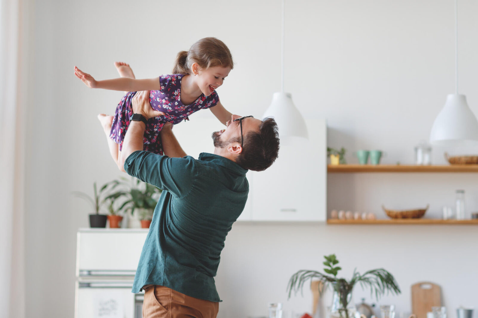 Father's day. Happy family daughter hugs his dad on holiday