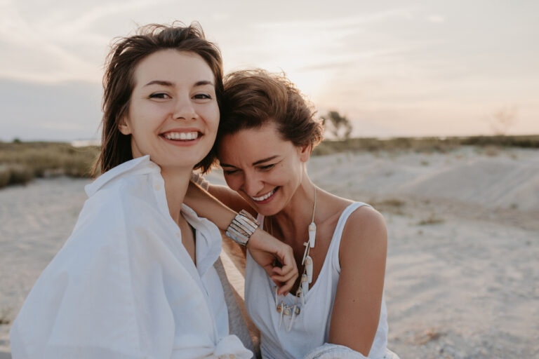 Smiling,Two,Young,Women,Friends,Having,Fun,On,The,Sunset