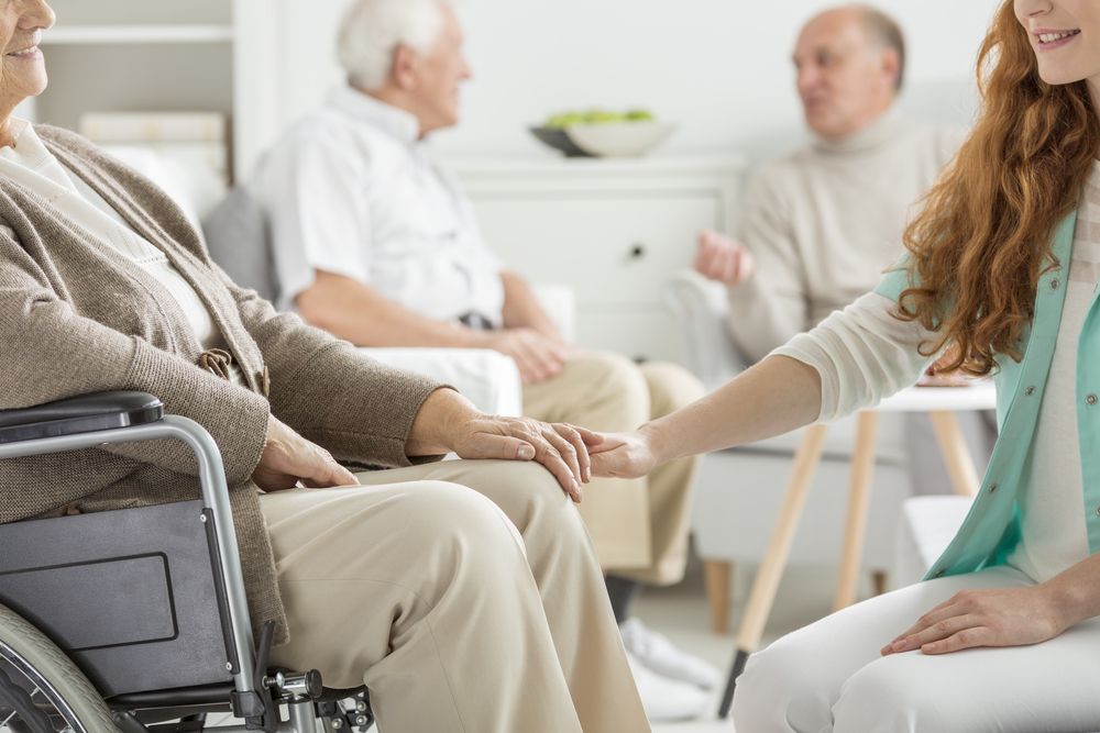 Skilled Nursing services helping someone in a wheel chair