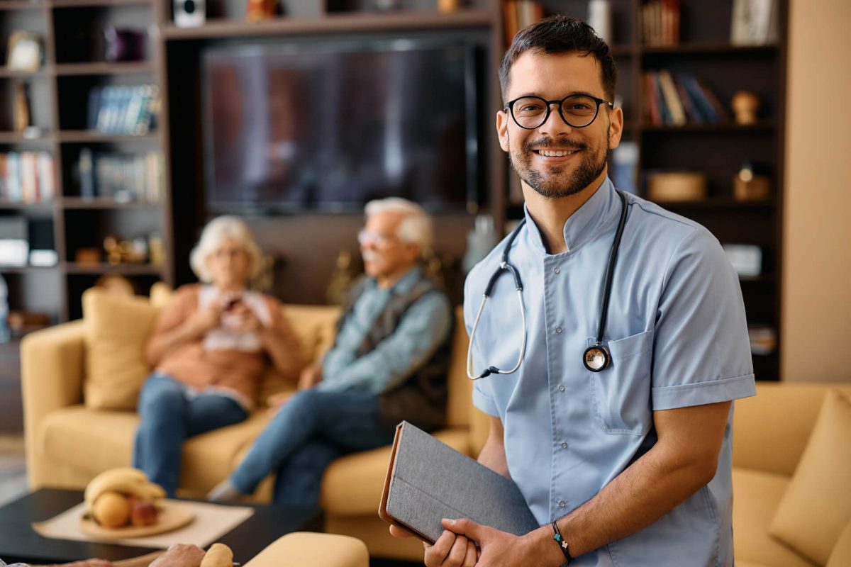 Portrait of young happy home caregiver at work