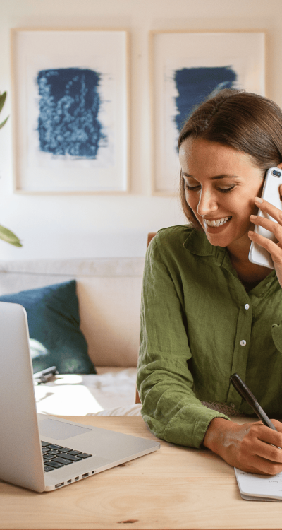 Women on phone making appointment
