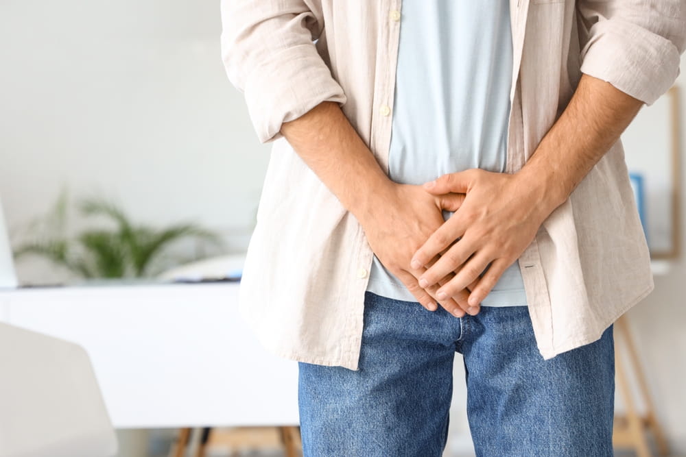 Young man with prostate problem in clinic, closeup. Cancer awareness concept