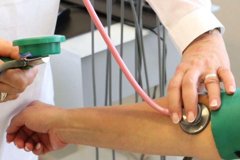 Doctor checking Blood pressure of a patient