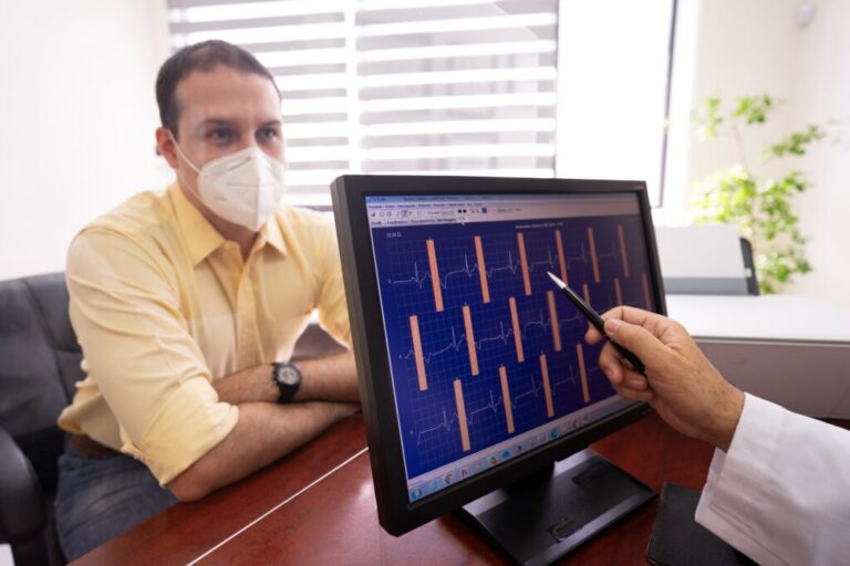 Doctor checking graph on a computer