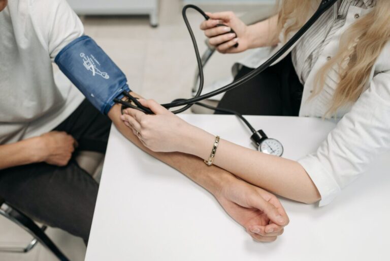 Doctor checking Blood pressure of a patient