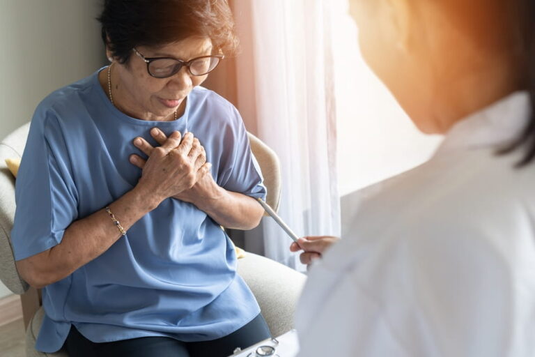 senior old aging woman with cardiologist doctor examining cardiovascular health, cardiac check up in clinic