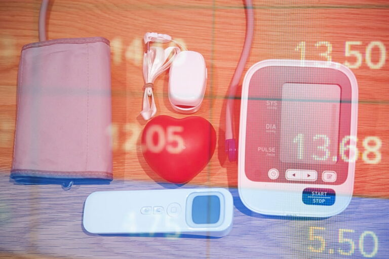red heart on a white background on the table. for health care and medical management