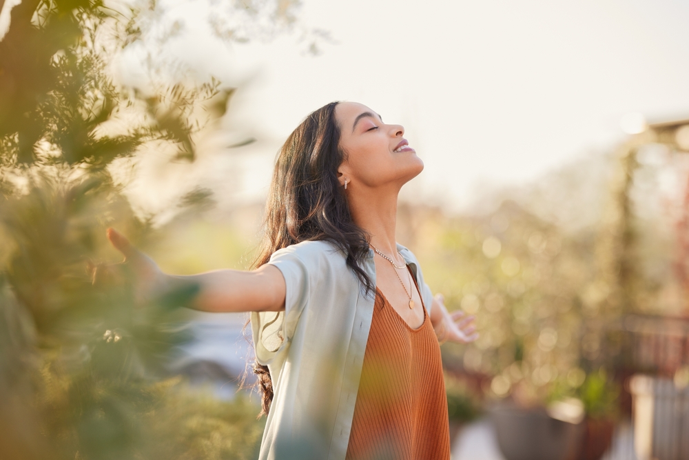 Young Latin Woman With Arms Outstretched