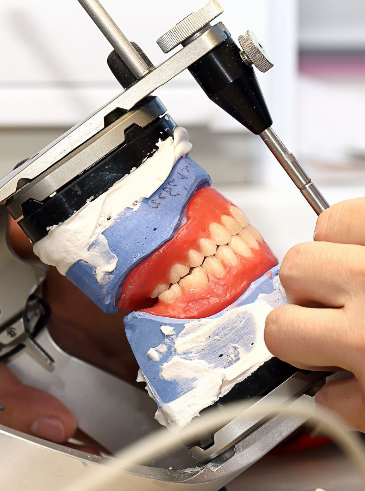 Dental laboratory working on dentures