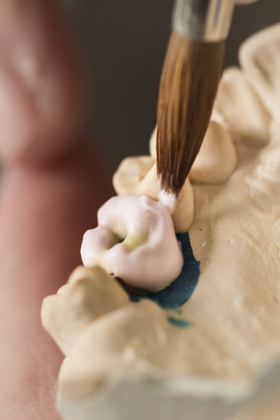 hands working on the denture