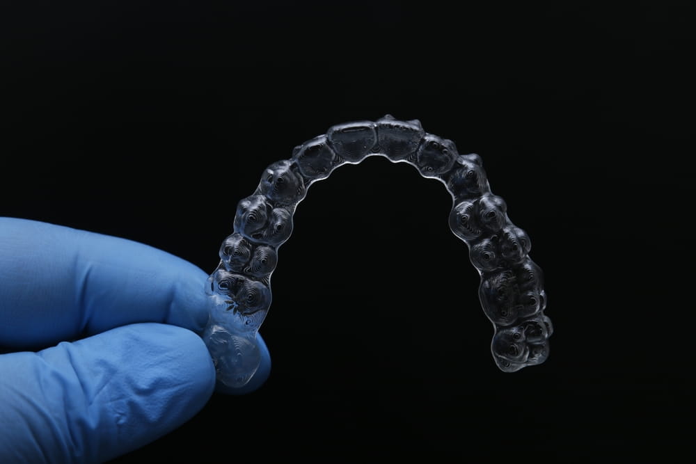 Clear aligners used in dental orthodontic treatments to correct crooked teeth.