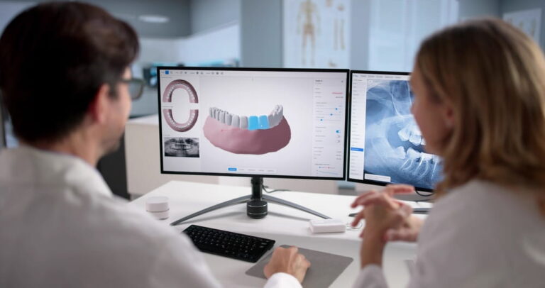Female Dentist Uses Computer Screen To Monitor Dental Disease In A Patient. Possible Professions: Dentist, Orthodontist