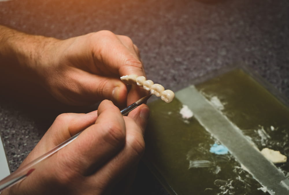 dental technician will design dental crowns. close-up. laboratory.