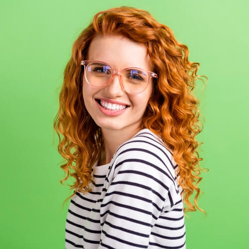 Photo of shiny adorable young lady dressed striped clothes