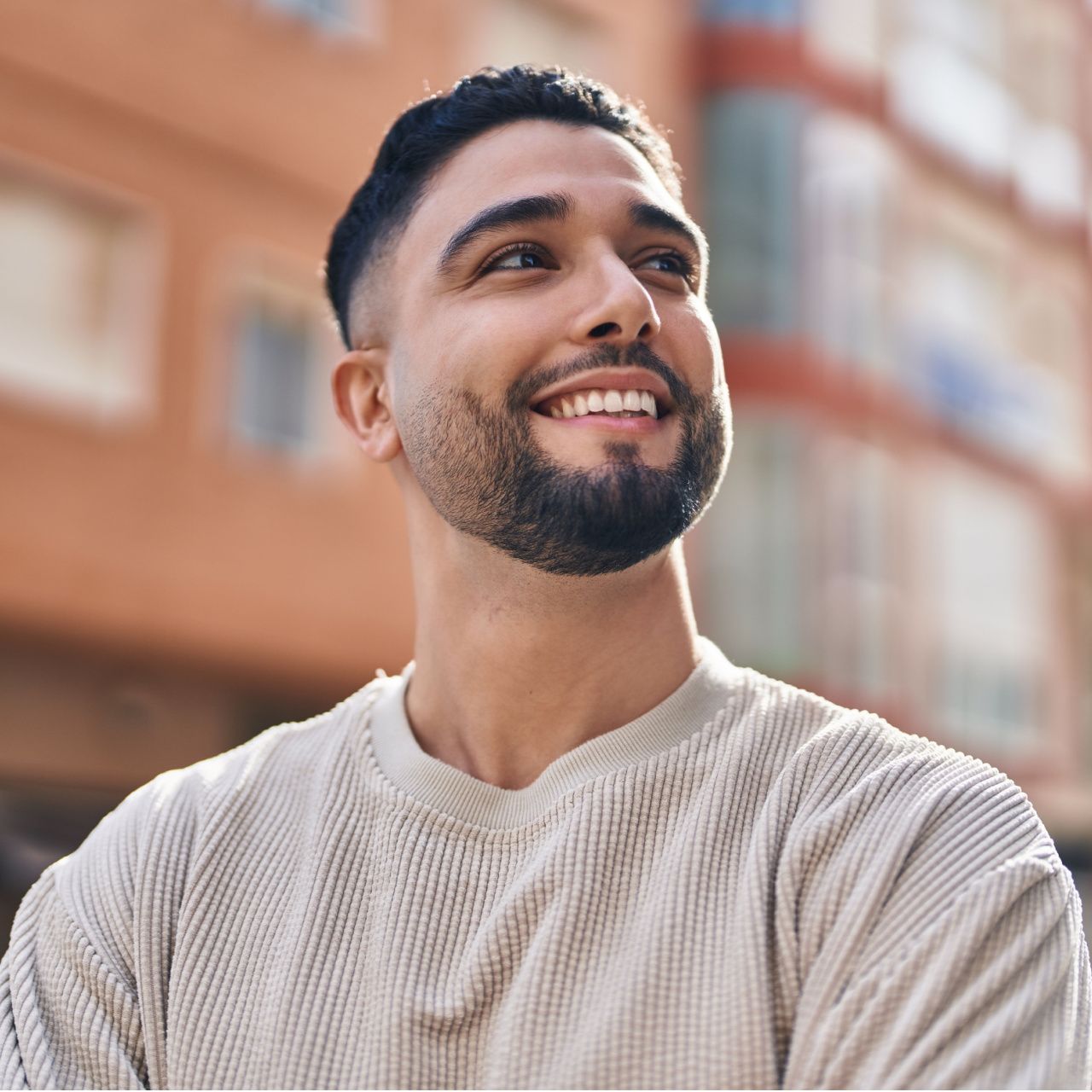 Young arab man smiling confident standing at street