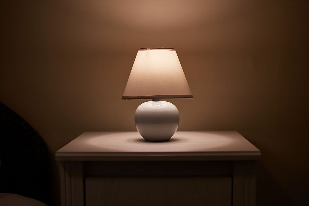 Small,Lamp,Glowing,In,Bedroom,Night,Stand,,Dim,Room