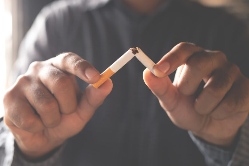Man refusing cigarettes concept for quitting smoking