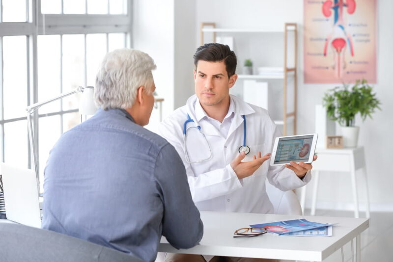 Senior man visiting urologist in clinic