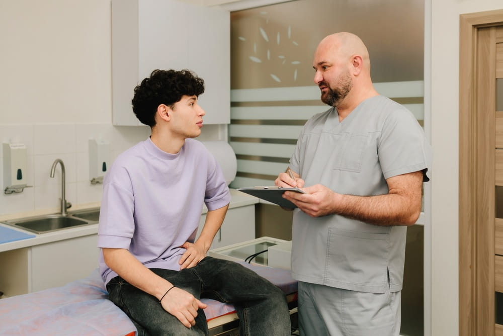 Urology checkup patient discussing urine symptoms and health history