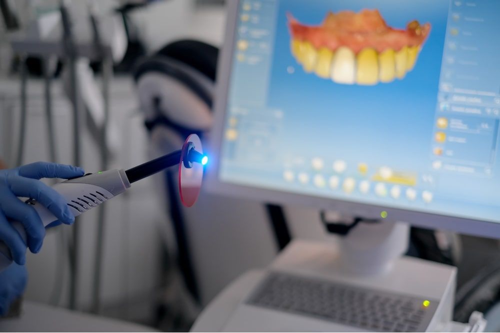Dental curing UV light on Cerec Monitor background