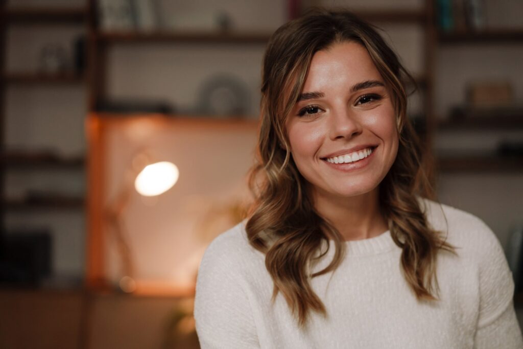 Close up of a smiling attractive young woman in the office