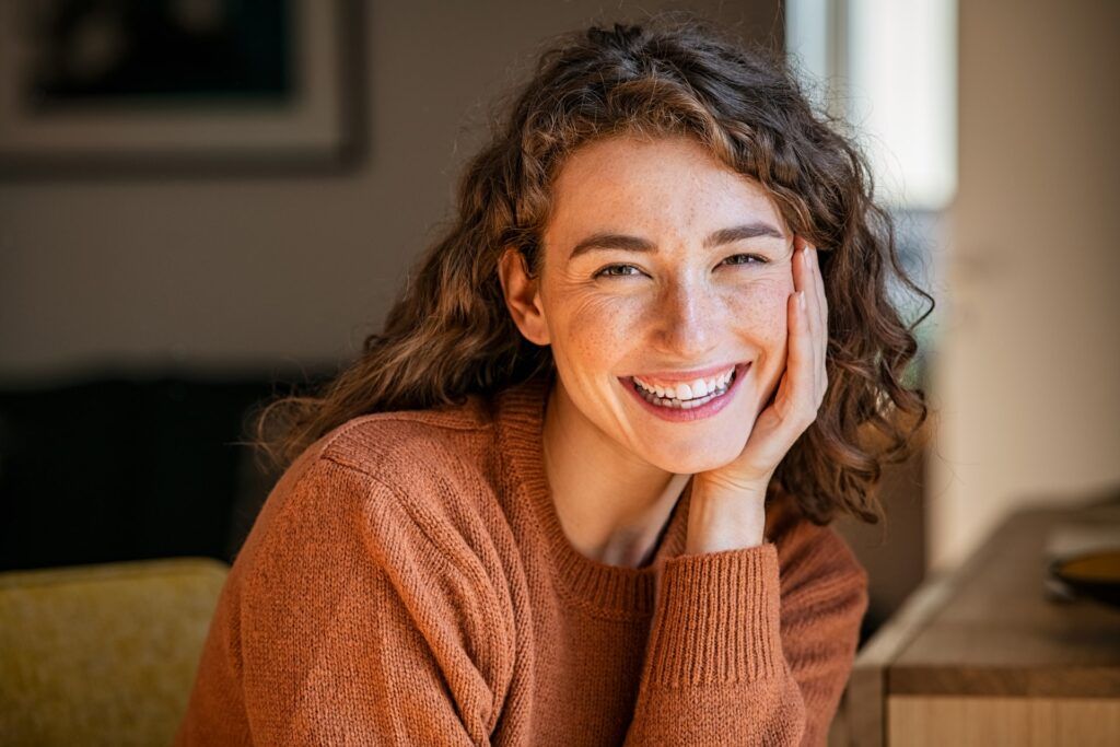 Happy woman smiling while looking at camera