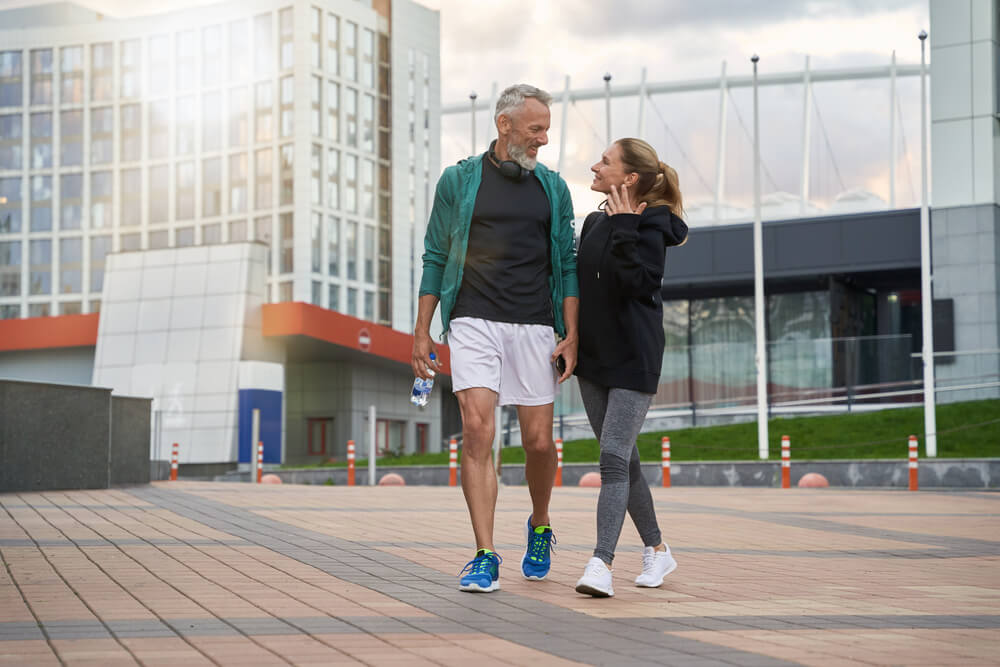 Full length shot of happy sportive middle aged couple