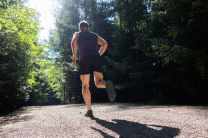 Man running in forest