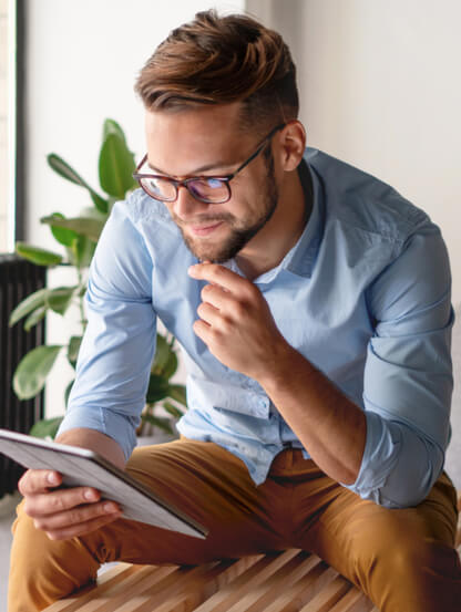 Young Man looking at digital tablet