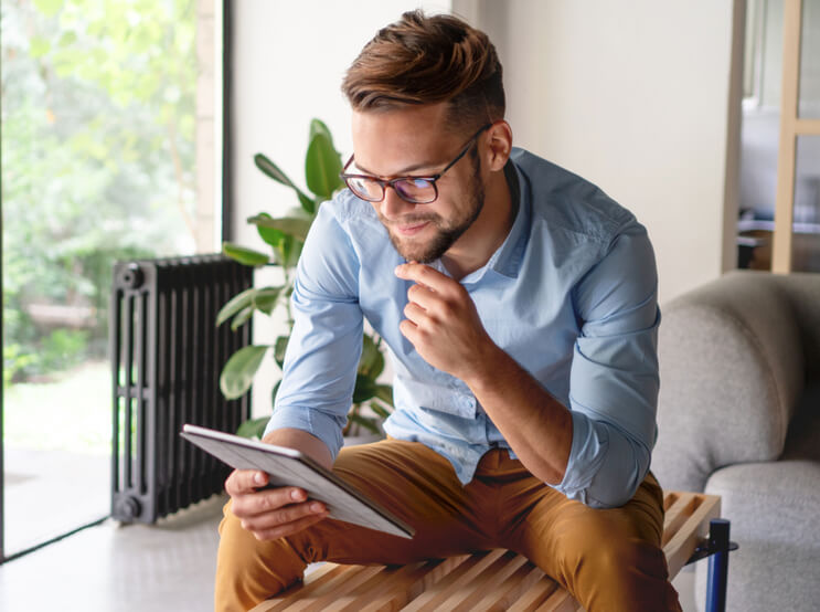 Young Man looking at digital tablet