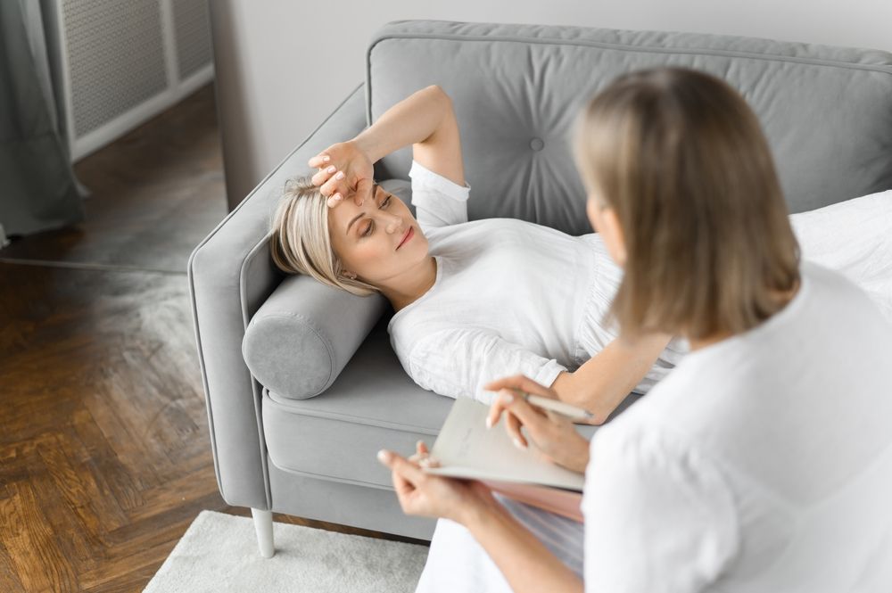 Psychologist treating patient on couch.jpg