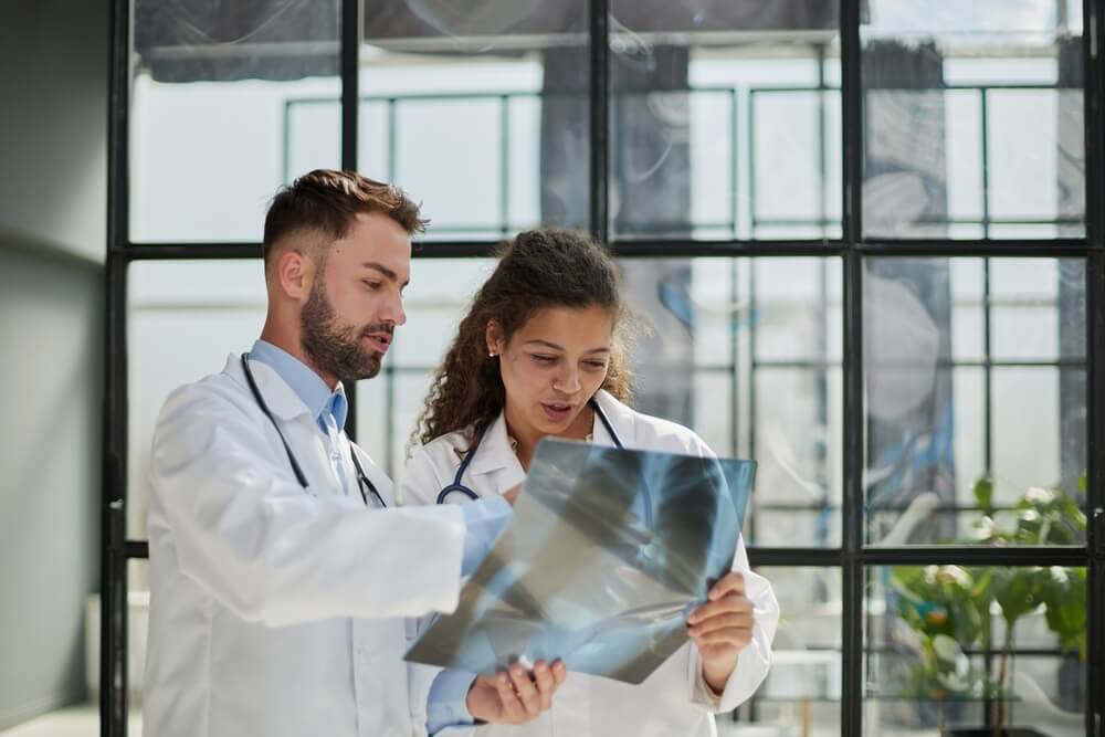 Dentists looking at x-ray image