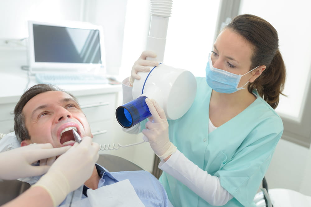 dentists doing an x-ray scan dental clinic office