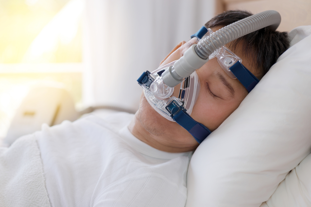 senior man wearing cpap mask sleeping smoothly all night