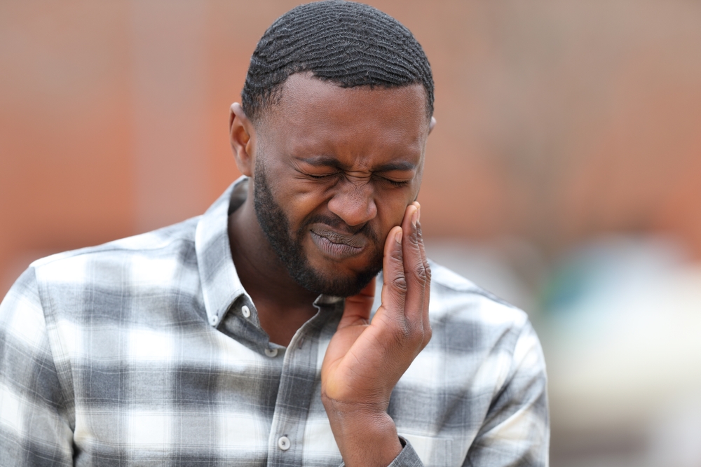 Front View Portrait Of A Man With Black Skin Complaining