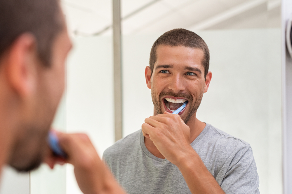 Man overbrushing teeth