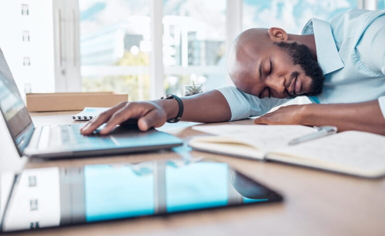 Sleeping, tired and black businessman in office