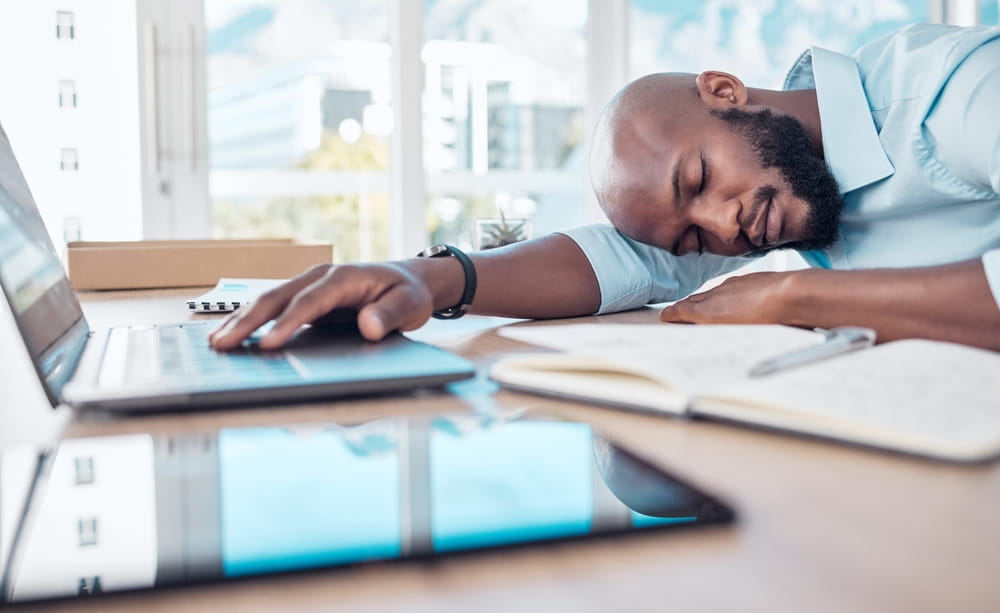 Sleeping, tired and black businessman in office